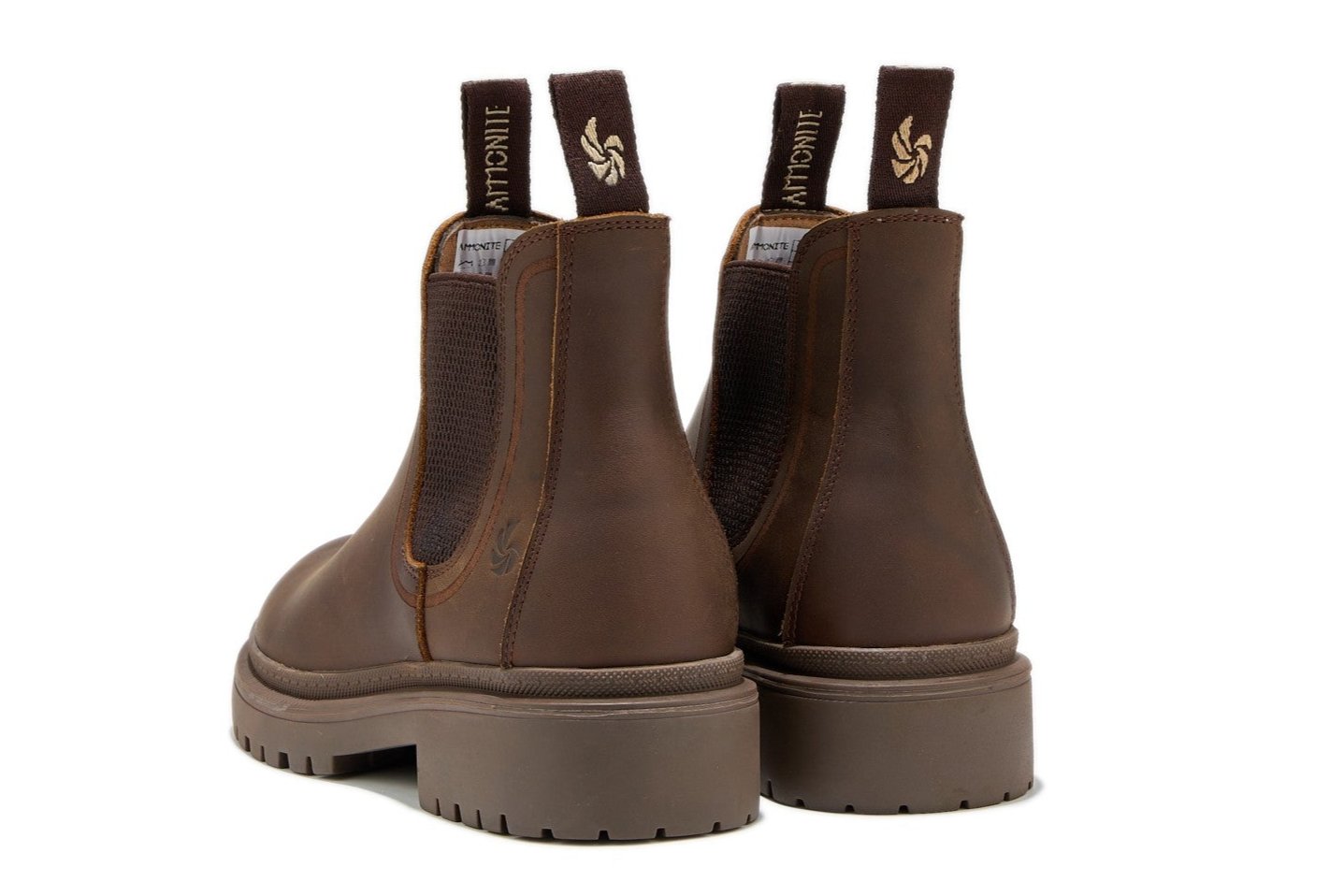 Women’s brown outdoor chelsea boots, slightly angled back view showcasing pull tabs and on a white background.