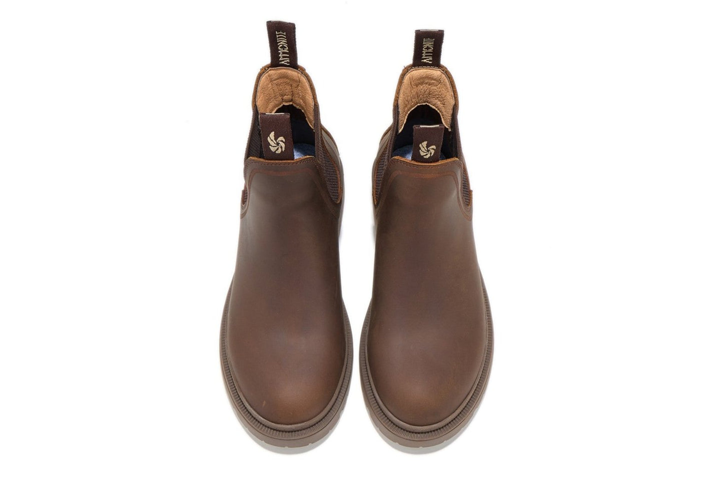 Women’s brown outdoor chelsea boots, top-down view showing sleek design and shape on a white background.