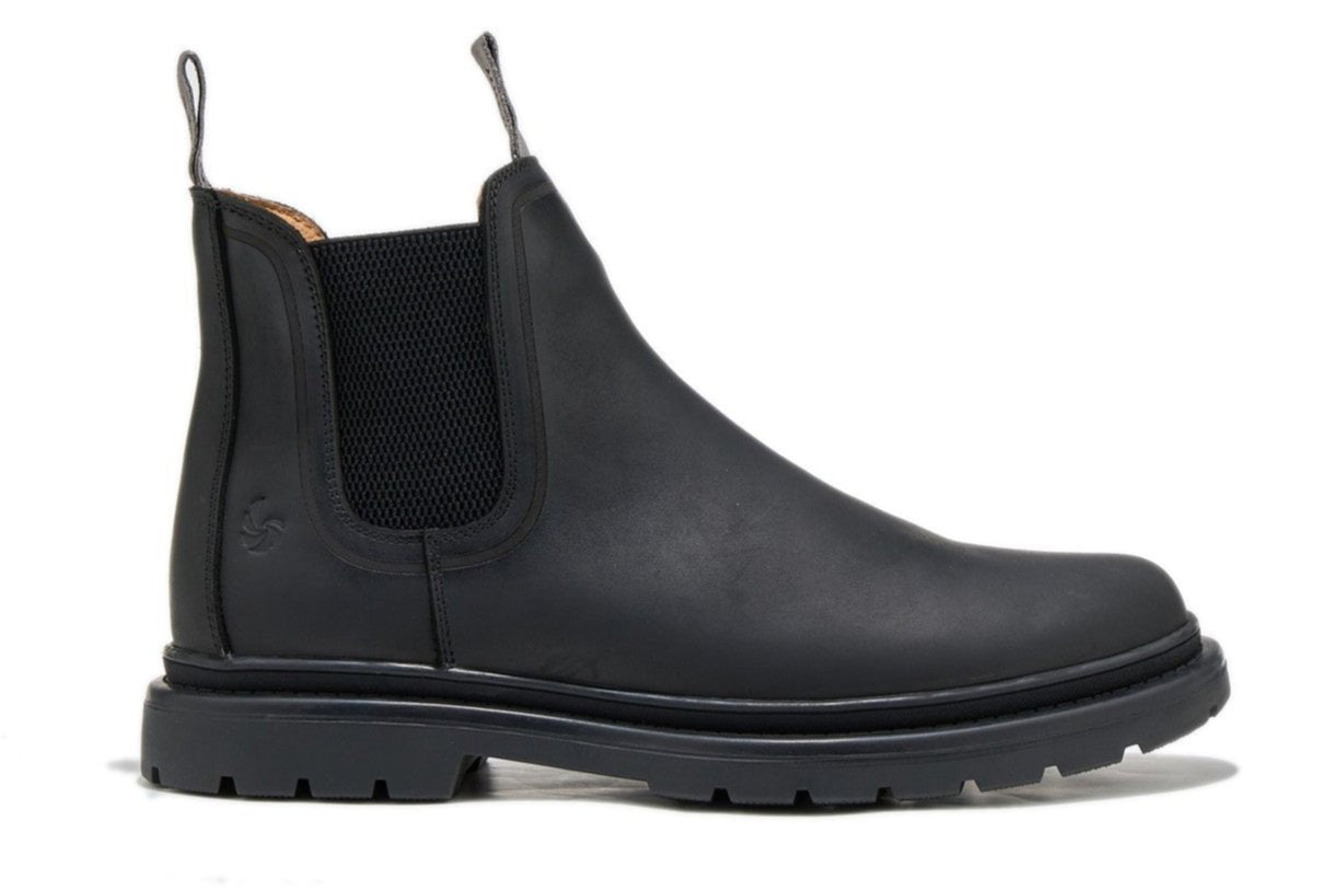 Men’s black outdoor chelsea boot, side view on a white background.