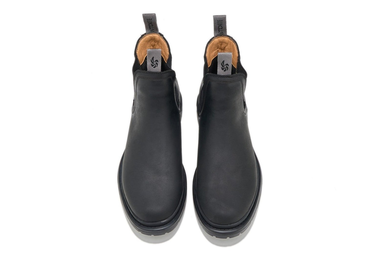 Men’s black outdoor chelsea boots, top-down view showing sleek design and shape on a white background.