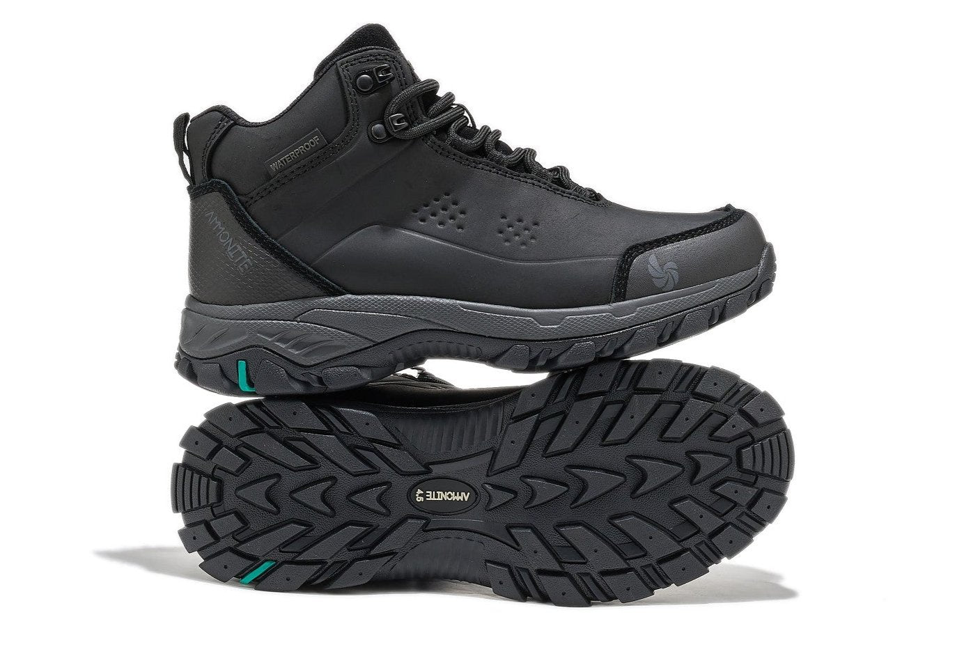 Women’s black waterproof hiking boots, one showing the sole and the other a side view, on a white background.