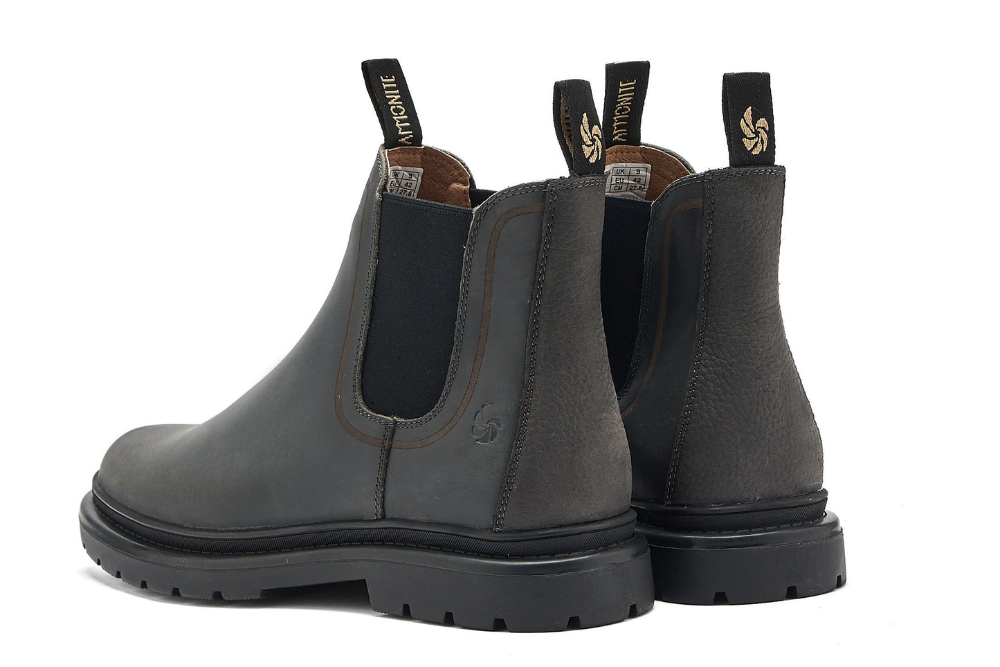 Back view of dark grey chelsea boots on a white background