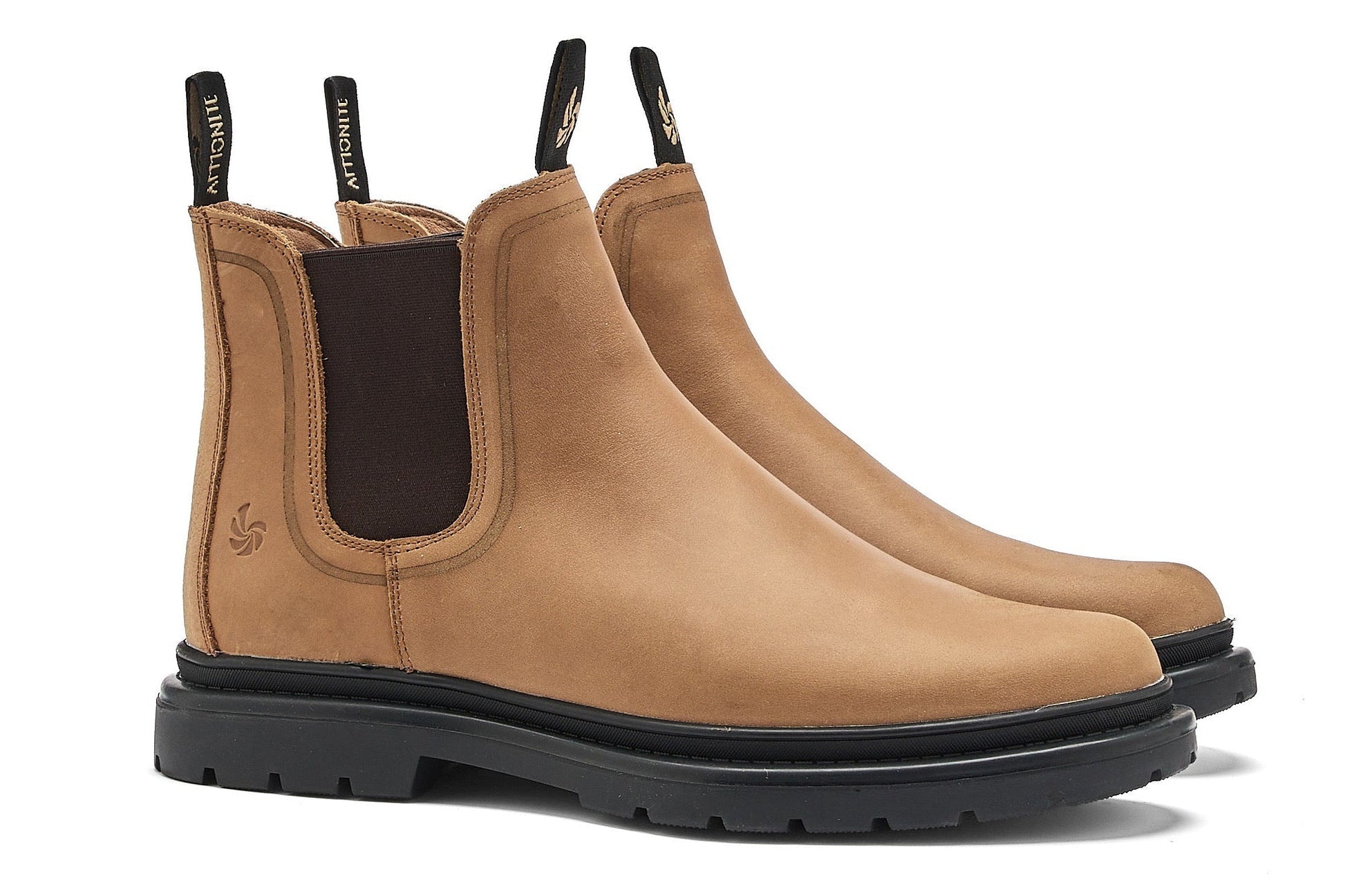 Light brown chelsea boots on a white background