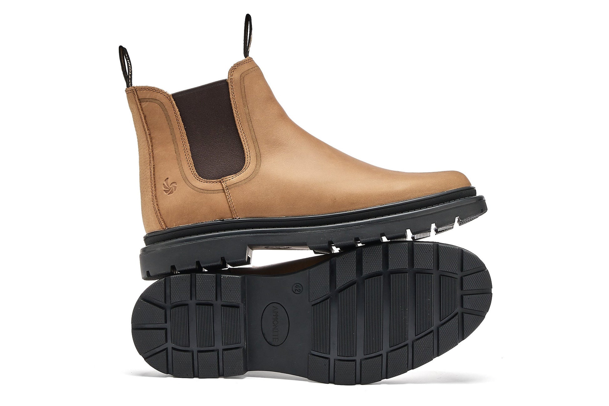 light brown chelsea boots on a white background