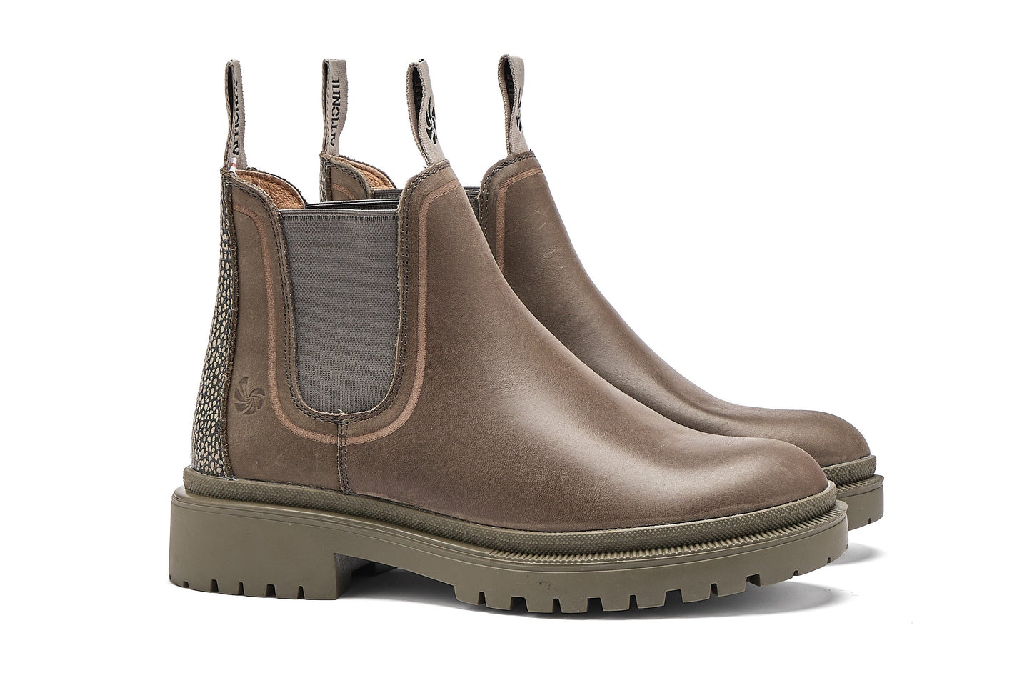 Pair of grey Chelsea boots on a white background