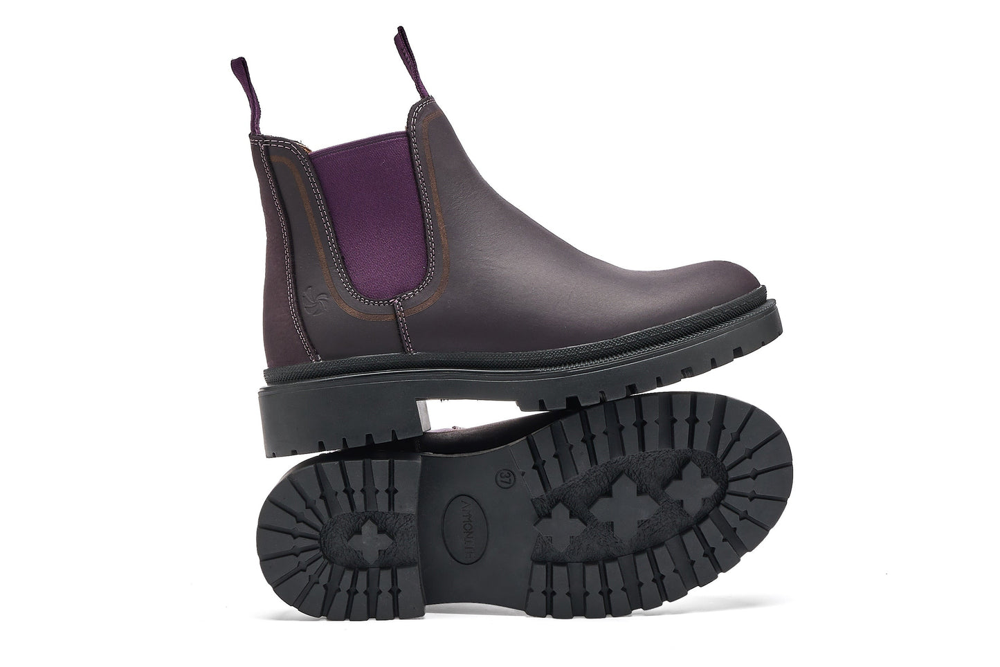 Purple chelsea boot with a white background