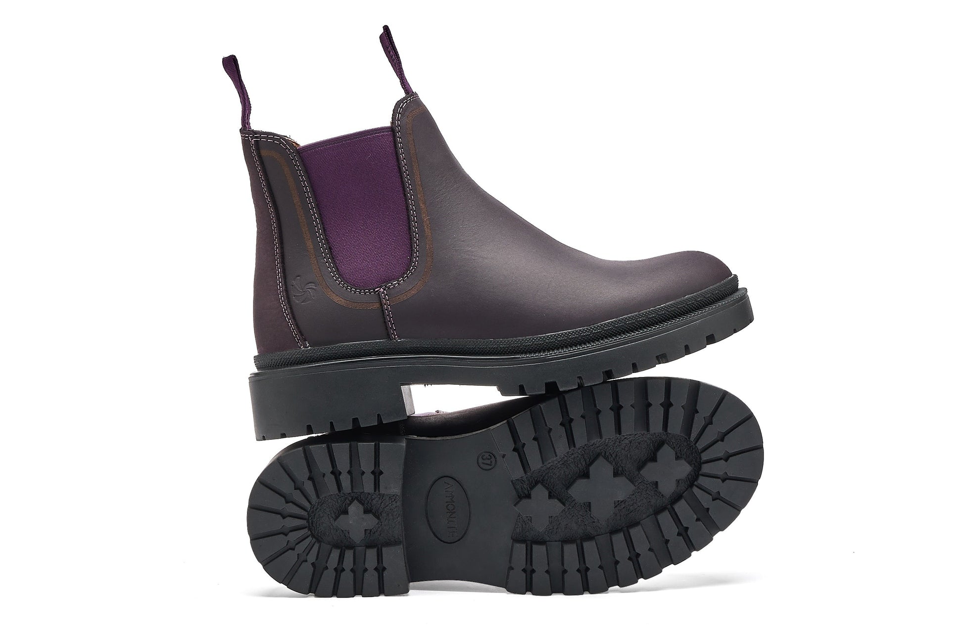 Purple chelsea boot with a white background